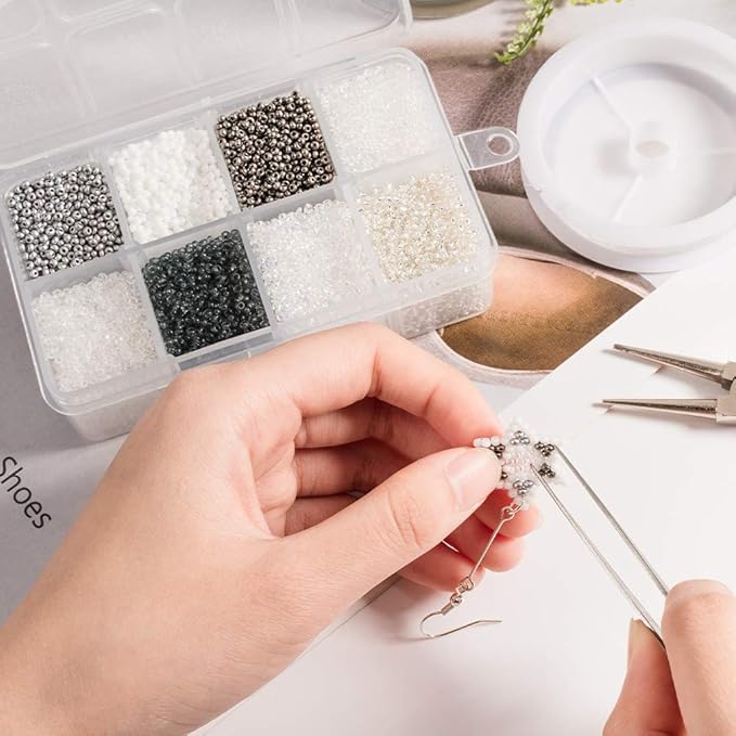 NBEADS 160g 20g/Compartment Round Glass Seed Beads, 8 Assorted Colors Mixed Style 2mm Tiny Loose Spacer Beads Pony Beads with 0.3mm-0.9mm Hole for DIY Craft Bracelet Necklace Jewelry Making