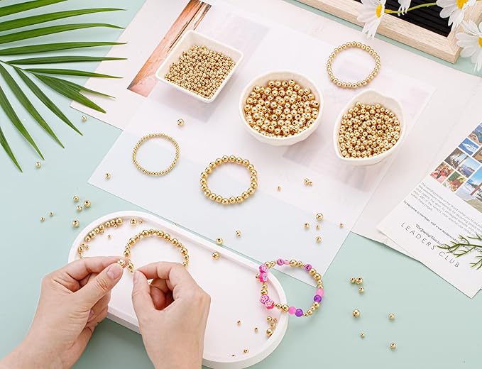 DUQGUHO 1500 Pcs Gold Spacer Beads - 8mm, 6mm, 4mm for Stackable Bracelets - Smooth Round Loose Plastic Copper Beads - Bulk