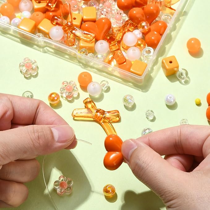 Ipotkitt 130 Pcs Acrylic Mixed Shape Beads Orange Color Beads Heart Round Bowknot Cube Barrel Spacer Beads for DIY Necklace Bracelets Jewelry Making