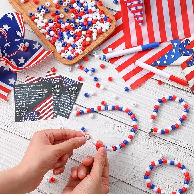 Zeyune 30 Sets Memorial Day Beaded Bracelet Kit, 1029 Pcs Red White Blue DIY Patriotic Bracelet Making Set with USA Letter Beads, Flag Charms, Cards and Bags for Memorial Day Party Favors